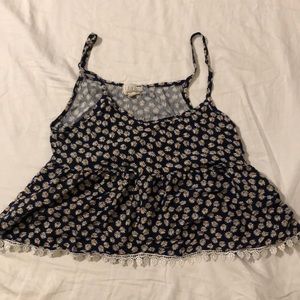 Babydoll-style cropped floral tank top